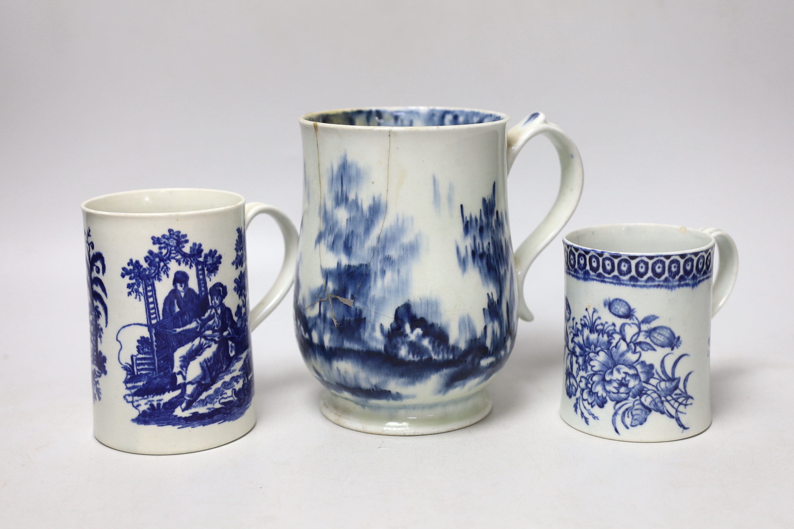 Two late 18th century Worcester blue and white mugs and a Pennington, Liverpool mug, largest 15.5cm high